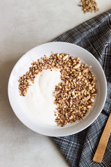 A bowl of homemade granola or muesli and yogurt. Healthy breakfast.