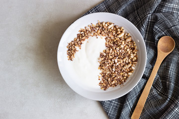 A bowl of homemade granola or muesli and yogurt. Healthy breakfast.