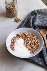A bowl of homemade granola or muesli and yogurt. Healthy breakfast.
