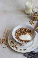 A bowl of homemade granola or muesli and yogurt. Healthy breakfast.
