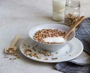 A bowl of homemade granola or muesli and yogurt. Healthy breakfast.