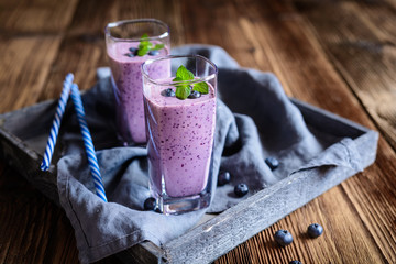 Blueberry milkshake in glass jars - obrazy, fototapety, plakaty