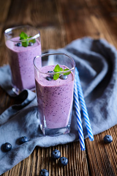 Blueberry milkshake in glass jars