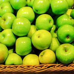 Crop of apples. Many typical ripe apples in a plastic box.