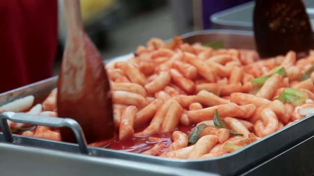 Thailand street food vendor cooking a toppoki.