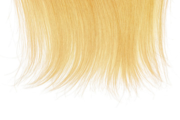 Tips of blond hair on white background