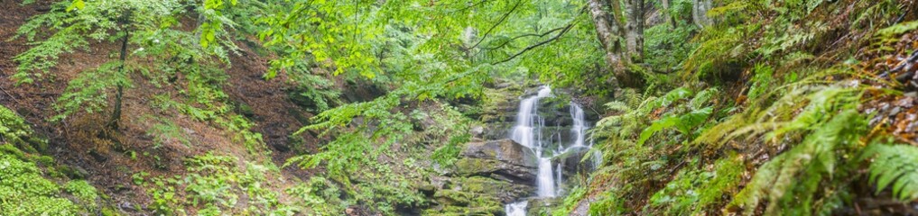 wide angle panorama in canyon with waterfall