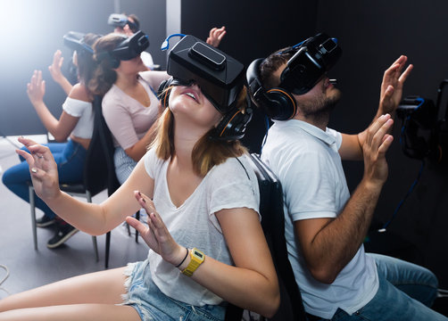 men and women try virtual reality in the 3d glasses