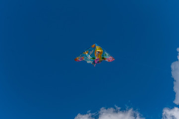Kite flying in the sky. Couds in the background.