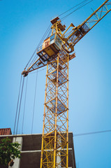 Crane on a blue sky background.
