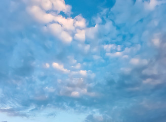 blue sky with white and gray clouds before rain