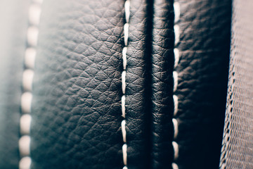 Stitched leather upholstery car seat detail