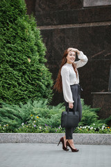 Portrait of a business woman in city streets