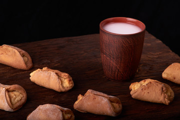 Cottage cheese homemade cookies and cold milk in glass. Close-up. Selective focus.