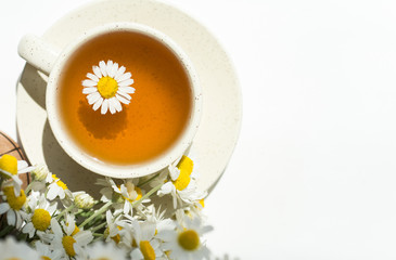cup of herbal chamomile tea with camomile dry blossoms, dried camomile flowers. doctor treatment and prevention of immune concept, medicine - folk, alternative, complementary, traditional medicine 