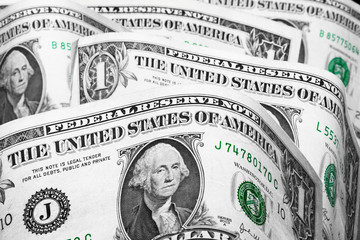 United States Dollars Closeup Concept. American Dollars Cash Money. One Dollar Banknotes. Background of 1 dollar bills in vertical half-torn position.