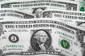 United States Dollars Closeup Concept. American Dollars Cash Money. One Dollar Banknotes. Background of 1 dollar bills in vertical position.