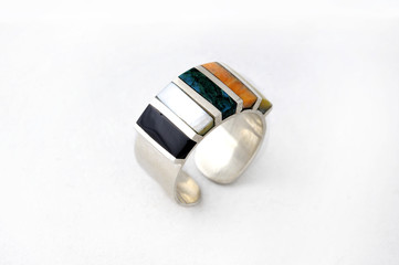 Modern jewelry incorporating Inca designs
