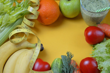 Green healthy juice with fruits and vegetables different colors on yellow background close up, copy space. diet vegitarians healthy low-calorie food