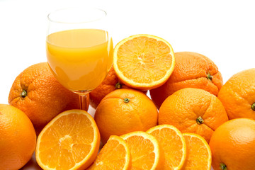 Juice glass and orange fruit isolated on white background
