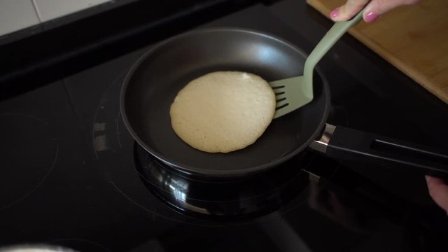 Cooking american style pancakes on kitchen