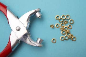 tool for installing eyelets in clothes
