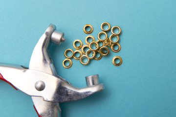 tool for installing eyelets in clothes
