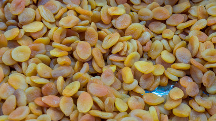 Dried apricots background, tropical fruits preservation in markets for gift and souvenirs