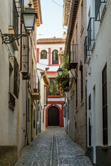 Street view of the colorful moorish neighbourhood in Granada, Spain