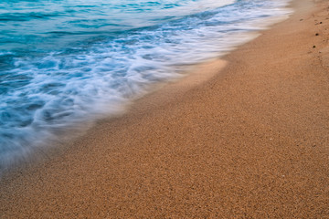 Wave on a sandy beach