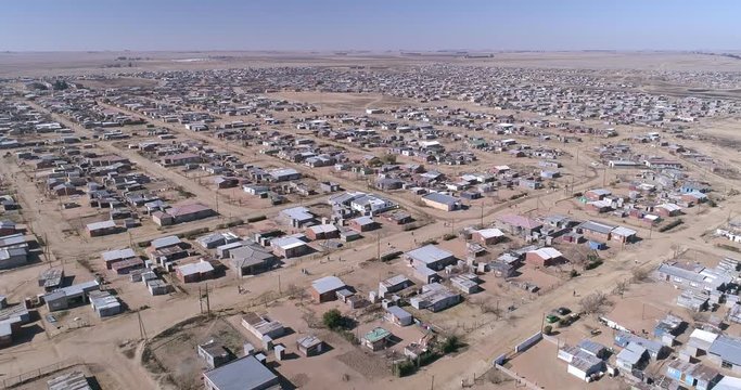Sprawling African town set in dry arid land with a flat horizon