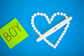 Pregnancy test. The result is positive with two strips. Treatment of infertility with pills, help...