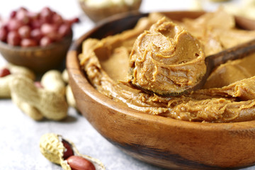 Homemade peanut butter with assortment of nuts.