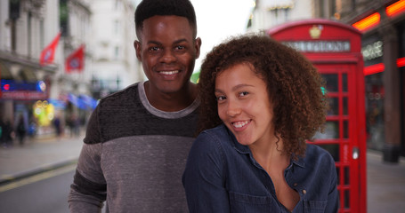 POV of happy African American couple video chatting from London