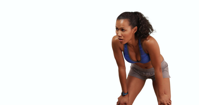 Toned Filipino Woman Jogger On White Background Resting On Her Knees