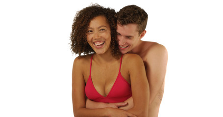 Happy affectionate couple embracing at the beach on white background