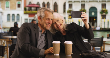 Mature couple taking a selfie in Venice