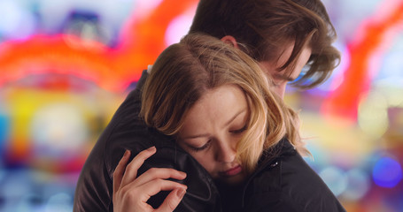 Close up of Caucasian man hugging his beautiful girlfriend