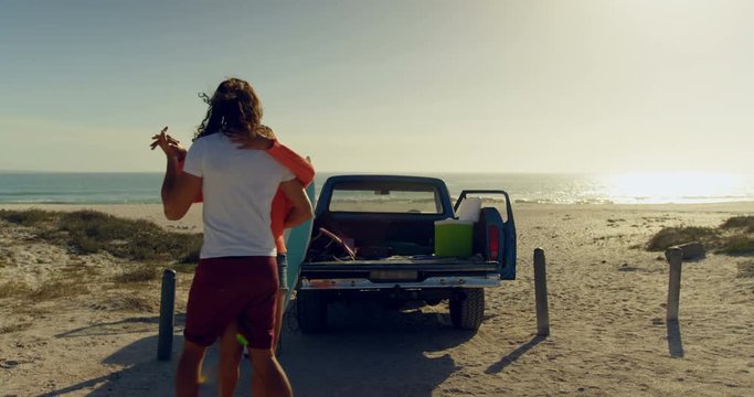 Couple dancing together on the beach 4k