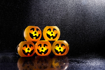 Jack o lantern for halloween 2018 on a black background with rain