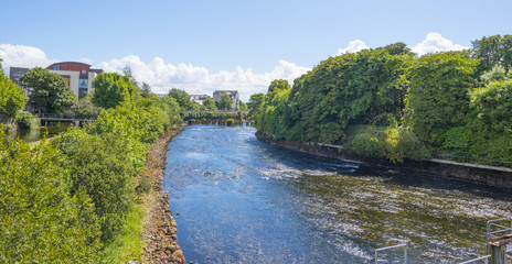 Fototapeta na wymiar River through the city of Galway in Ireland in summer
