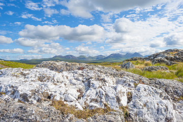 Panorama of mountains, marshy land and heathland of Connemara National Park in summer