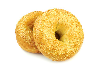Fresh sesame bagels isolated on white background.