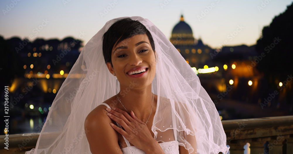 Wall mural happy beautiful bride in rome italy lifts away her veil laughing and excited - Wall murals