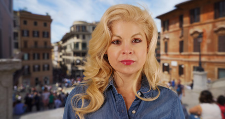 Fototapeta premium Pretty blonde woman vacationing in Rome Italy on urban streets