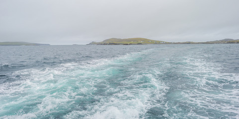View of an irish island from the atlantic ocean in summer