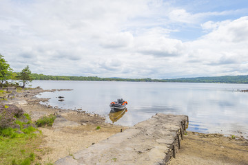 Fototapeta na wymiar Panorama of edge and surroundings of a lake in a national park in summer 