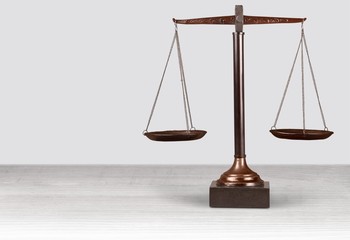 Law scales on table background