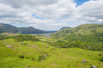 Obraz premium Scenic panorama of green mountains and blue lakes in summer 