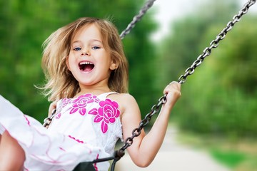 Little child blond girl having fun
